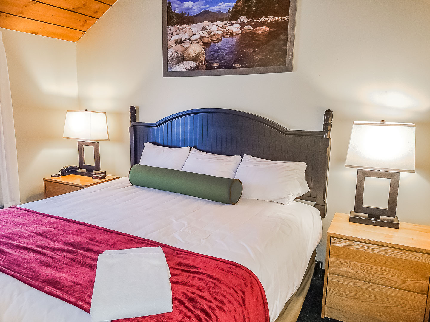 A renovated master bedroom at VRI's Village of Loon Mountain in New Hampshire.